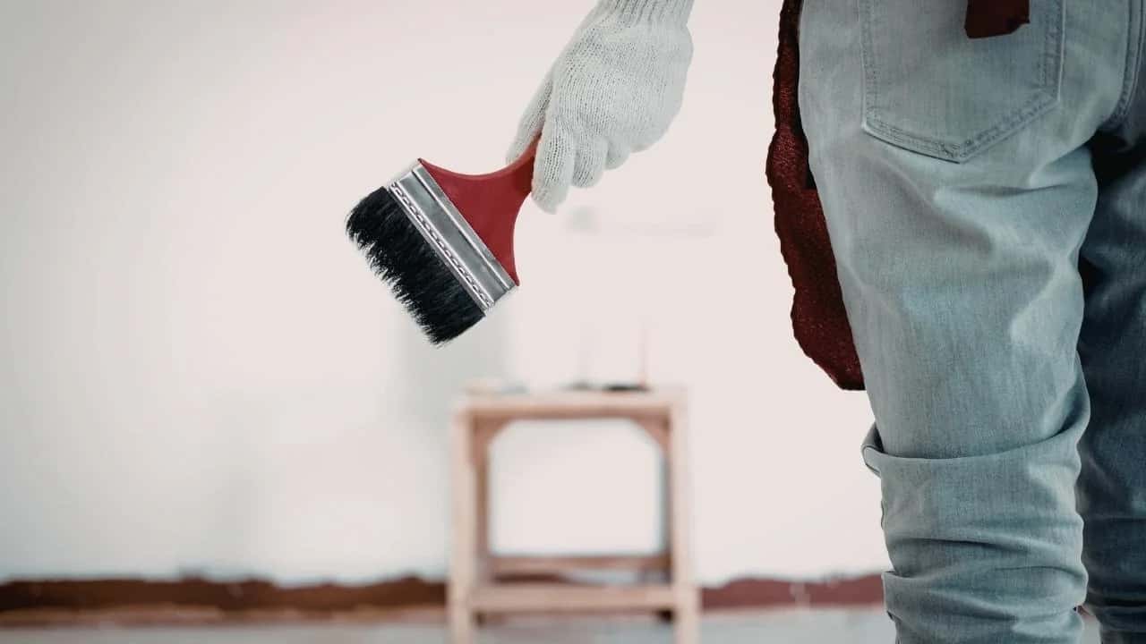 Professional painter transforming an Ottawa living room