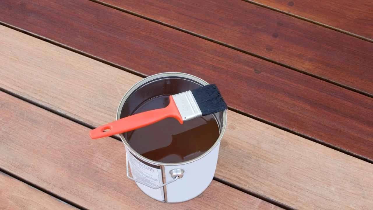 Deck painting specialists restoring a heritage home deck in historic urban village Vanier