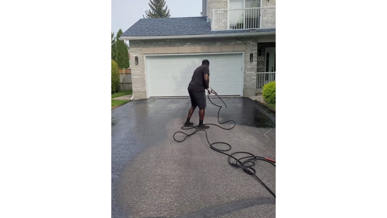 Founder spraying asphalt driveway in Ottawa