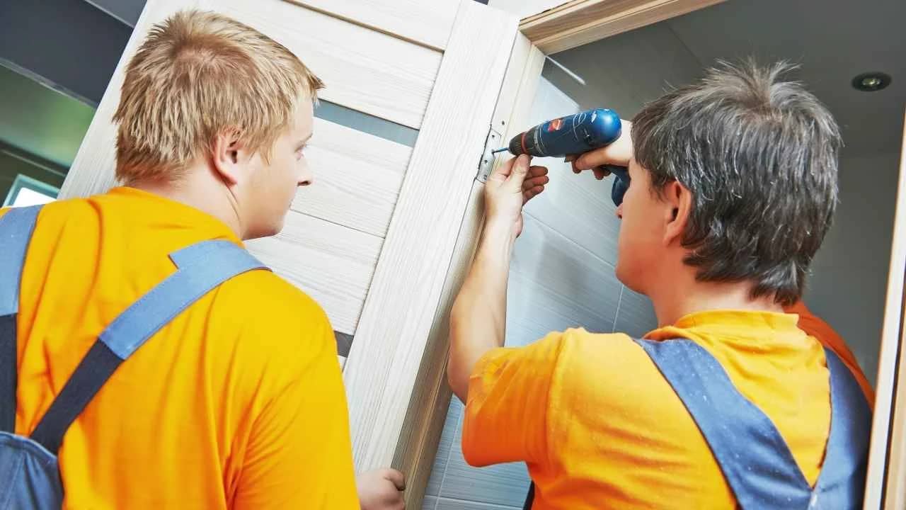 Door installation professional working on a historic Manotick home