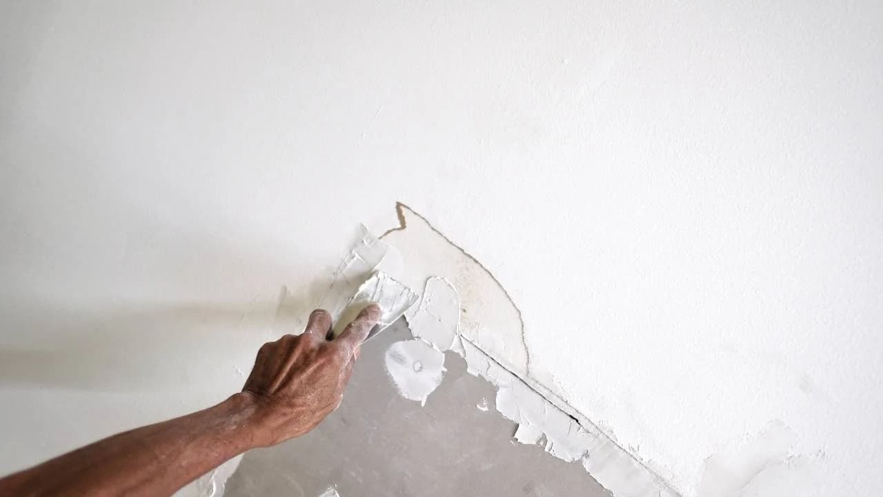 Professional drywall repair in Ottawa home - fixing holes and cracks